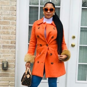 Orange winter coat with fur